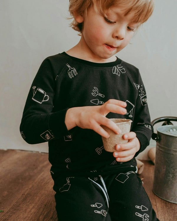 Boy wearing gender-neutral organic cotton kids sweatshirt