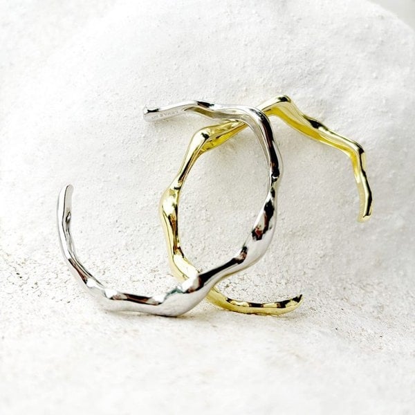 Silver and gold vermeil cuff bracelet displayed on white natural background.