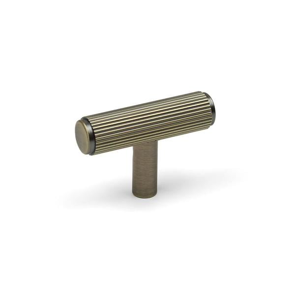 An antique brass reeded T-bar