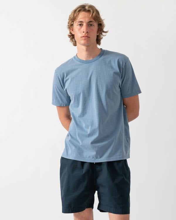 model wearing a Colorful Standard Classic Organic T-Shirt in Faded Indigo