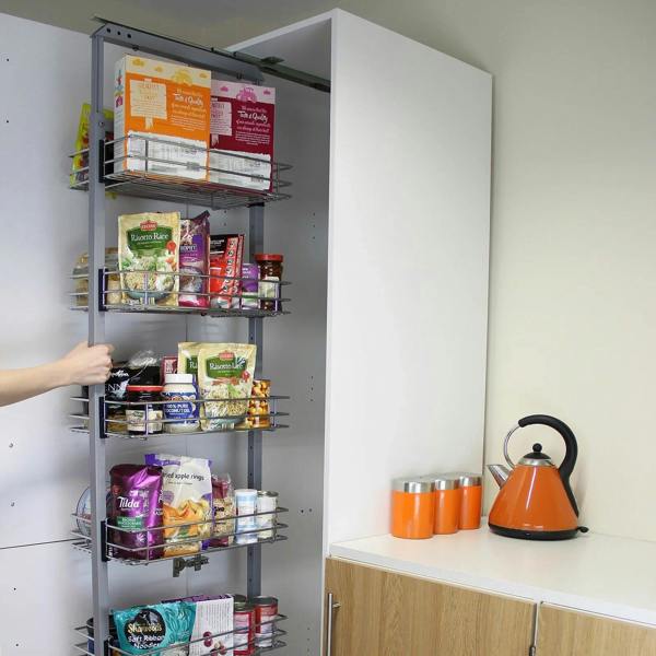 KuKoo pull-out soft close kitchen larder with multiple wire baskets, filled with food items, sleek white finish, and modern design