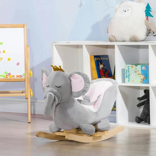 Grey elephant rocking horse side view with crown, pink-lined seat, and wooden rockers