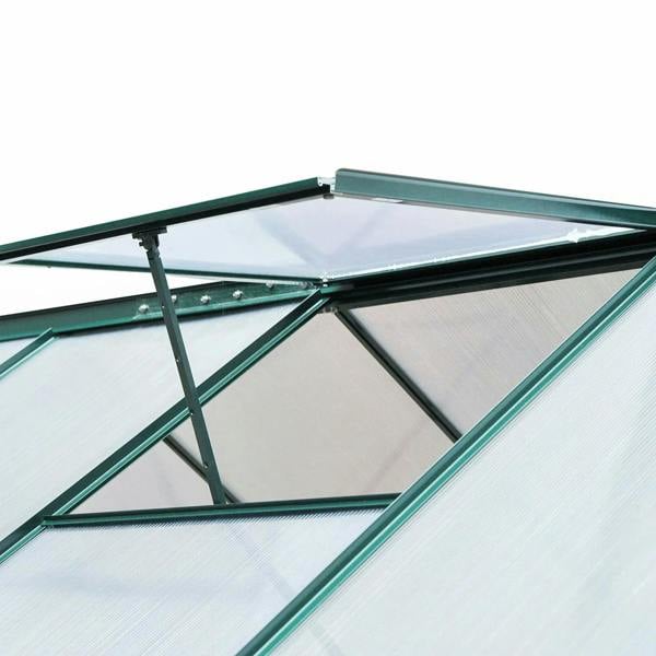 Close-up of dark green greenhouse roof frame with cross braces and transparent panels