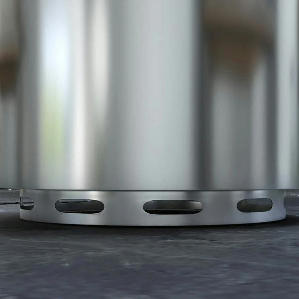 Close-up of silver stainless steel fire pit side with oval vent openings near the base