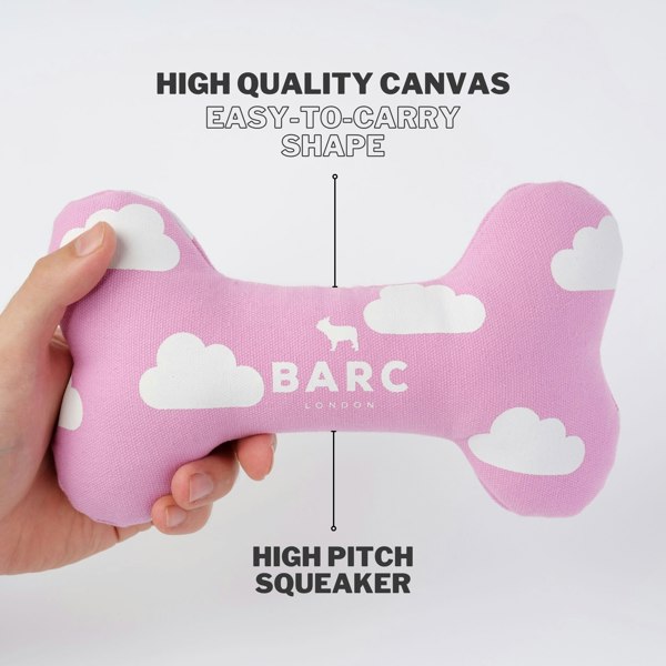 Pink Dog Bone Toy Made From Canvas With White Cloud Design and Squeaker