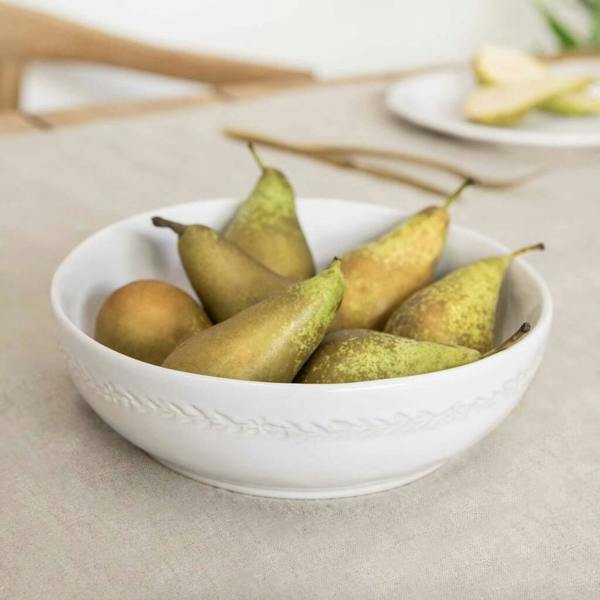 Abode Home & Gifts Brunswick white ceramic serving bowl filled with fresh pears on a linen tablecloth.