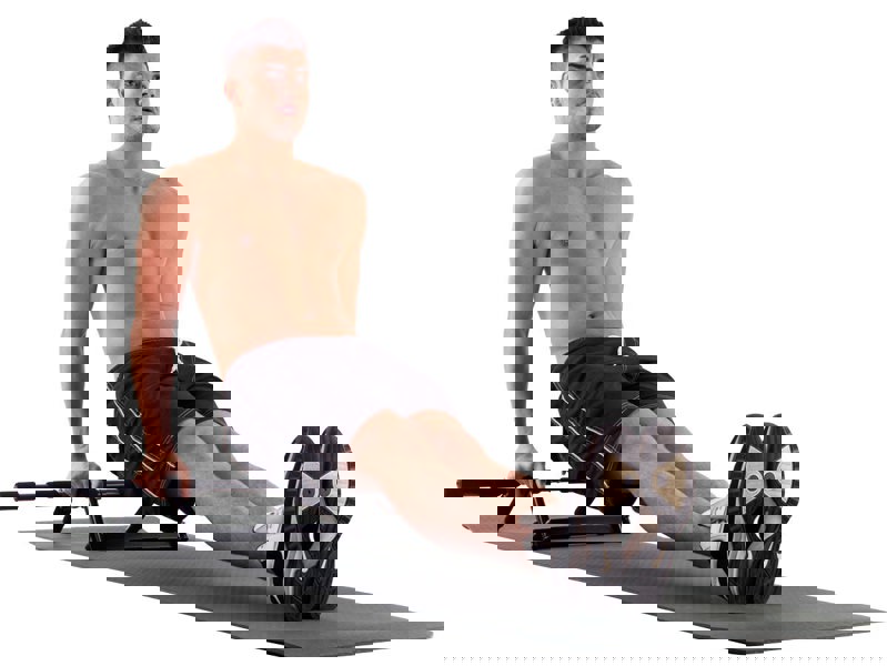 Man exercising on a mat using a Fitness Mad Universal Training Pull Up Bar