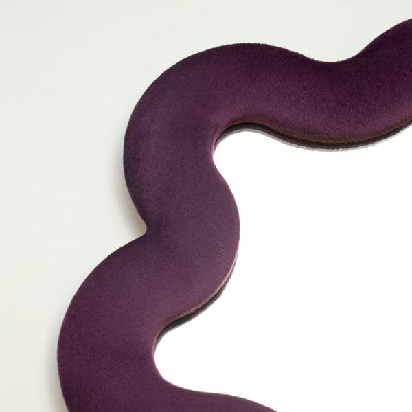Mauve soft fabric mirror edge with wavy profile and curved interior mirror opening