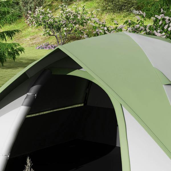 Close view of green dome tent roof panel with dark interior and arched entrance