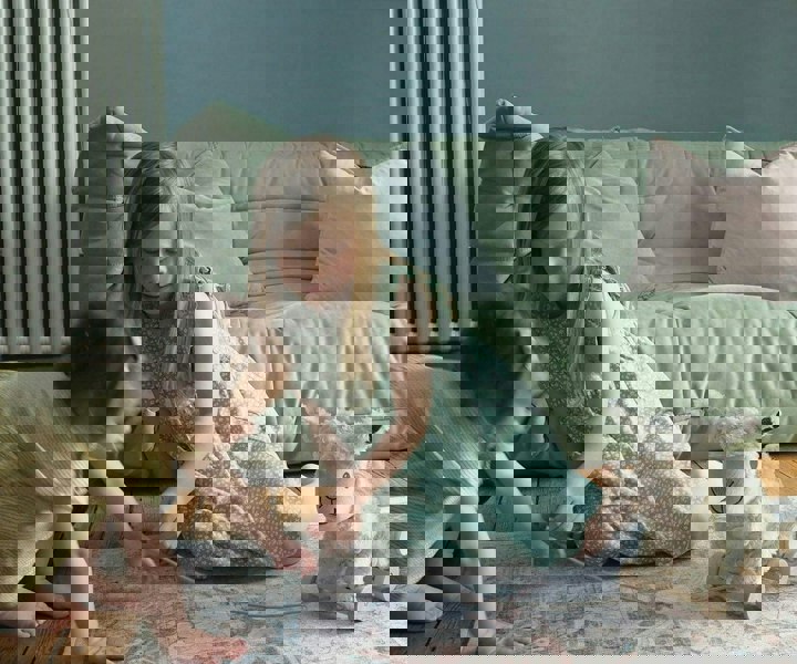 toddler girls playing with Lambert sheep teddy 