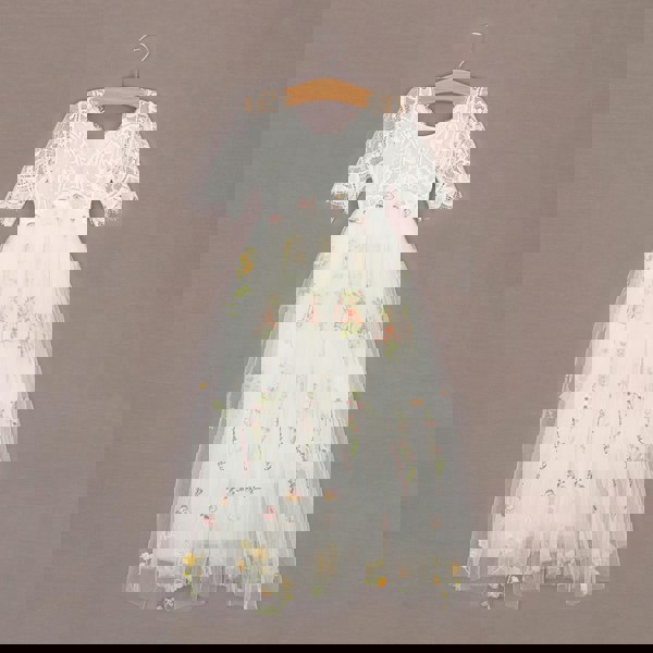 White lace detailing at rear of the dress