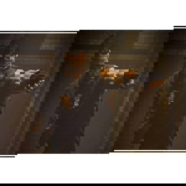 Man working out wearing Reebok Pro Quick Boxing Hand Wrap Gloves