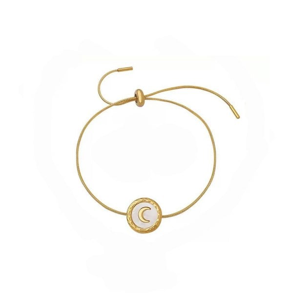 Gold bracelet with a moon symbol on a white background