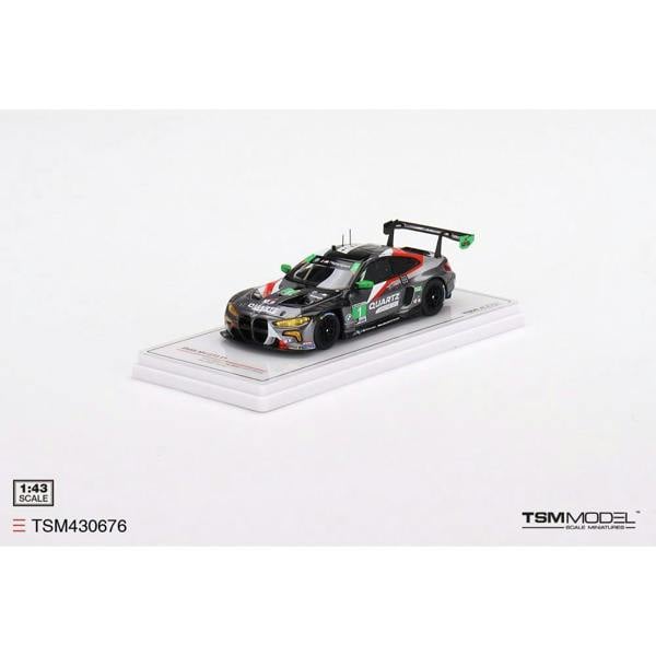 a toy car on a white surface