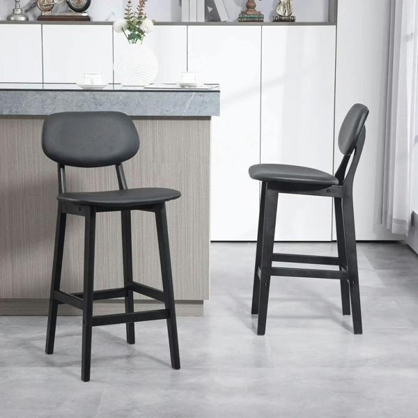 Pair of black wooden bar stools with faux-leather seats and upright backrests