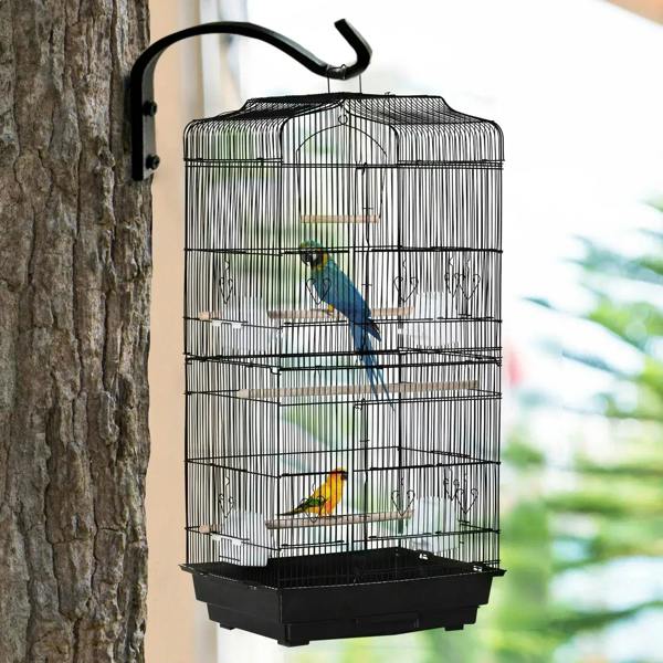 Black metal bird cage with domed top, perches, and feeding area