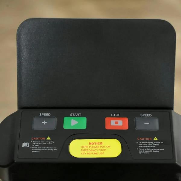 Black treadmill control buttons with speed plus start/stop and emergency key area