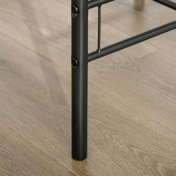 Close-up of black steel table leg with riveted corner joint