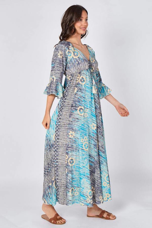Woman wearing a blue floral dress on a white background