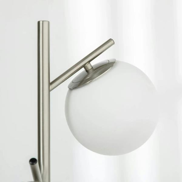 Silver 3-light globe floor lamp with round white glass shades and metal stand