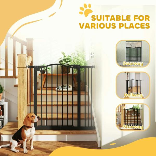 Black adjustable pet gate for home entry areas with a dog in front