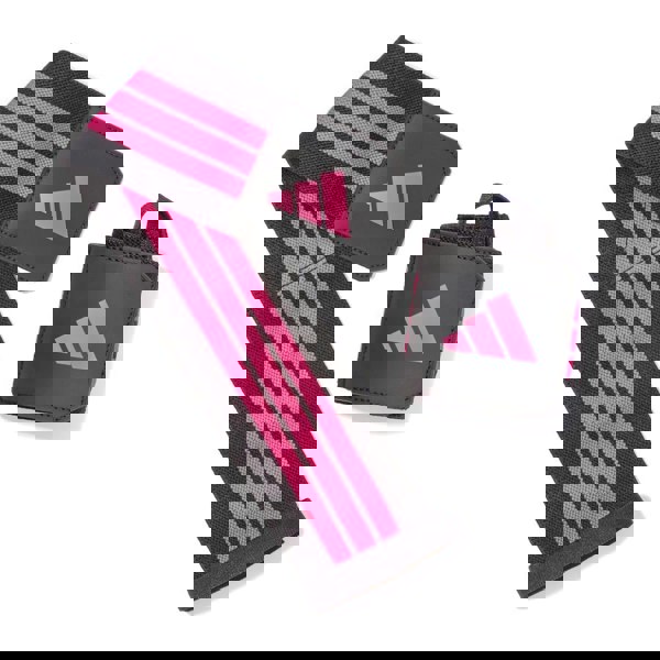 Black and pink wrist wrap swith Adidas logo on a white background