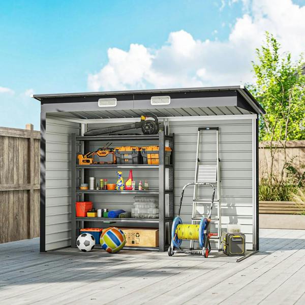 Grey metal storage shed with open doors and small ramp for wheeled items
