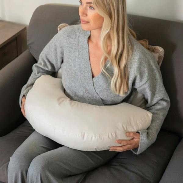 Organic British wool Nursing Pillow - Bottle & Breastfeeding Pillow with unbleached 100% cotton cover and visible zip, placed on a bed OEKOTEX standard 100 natural plastic free