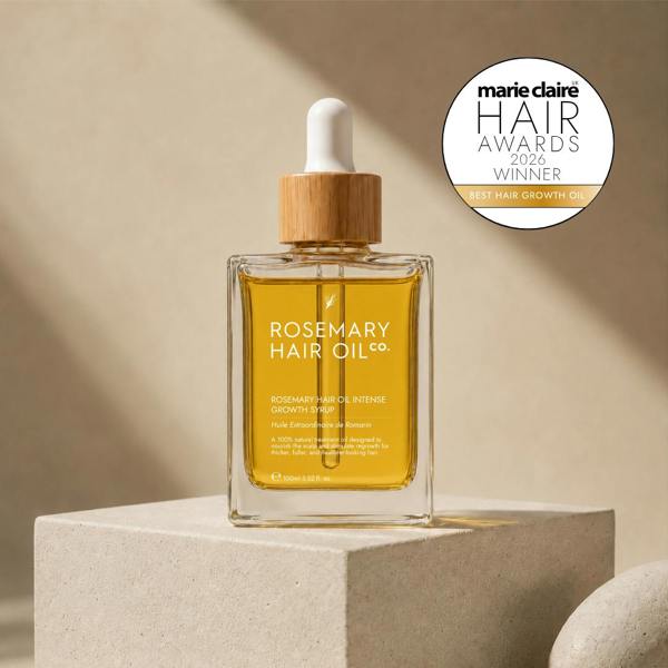 Rosemary hair oil bottle with dropper on a beige background, featuring Marie Claire Hair Awards 2026 winner badge. Rosemary hair oil, intense growth syrup, hair growth, rosemary oil, healthier, fuller-looking hair, castor oil, sunflower seed oil, stimulate, regrowth, hair thinning, natural, best hair growth oil 