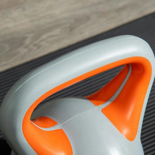 Close-up of orange handle and grey body on an 8 kg kettlebell