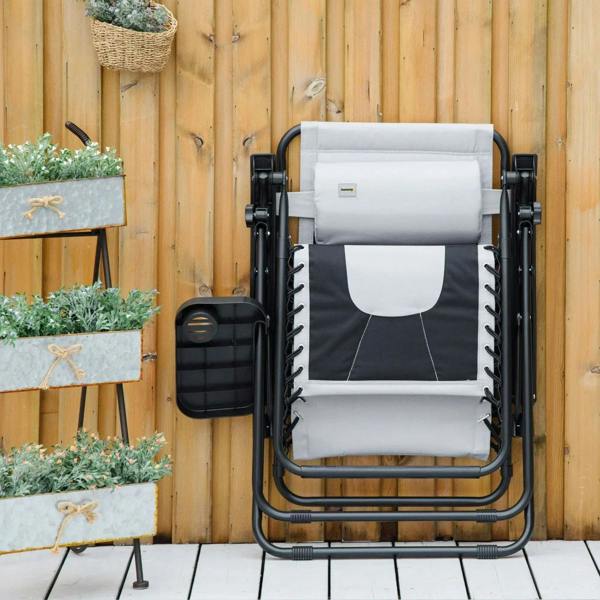 Folded transport position of a light grey padded reclining patio lounger chair with black frame