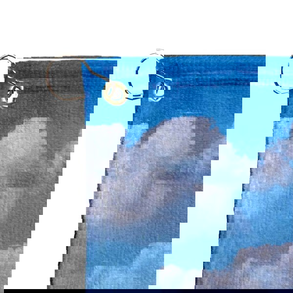 a keychain with a picture of clouds on it