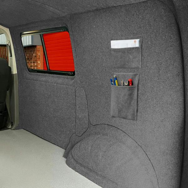 Smoke grey storage pouches with a soft texture, mounted on a wall, featuring pockets for organizing tools and supplies
