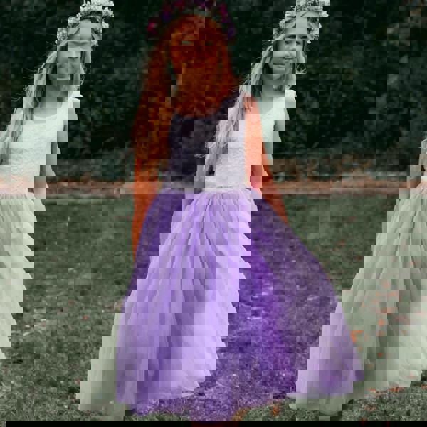 young girl wearing lilac flower girl dress