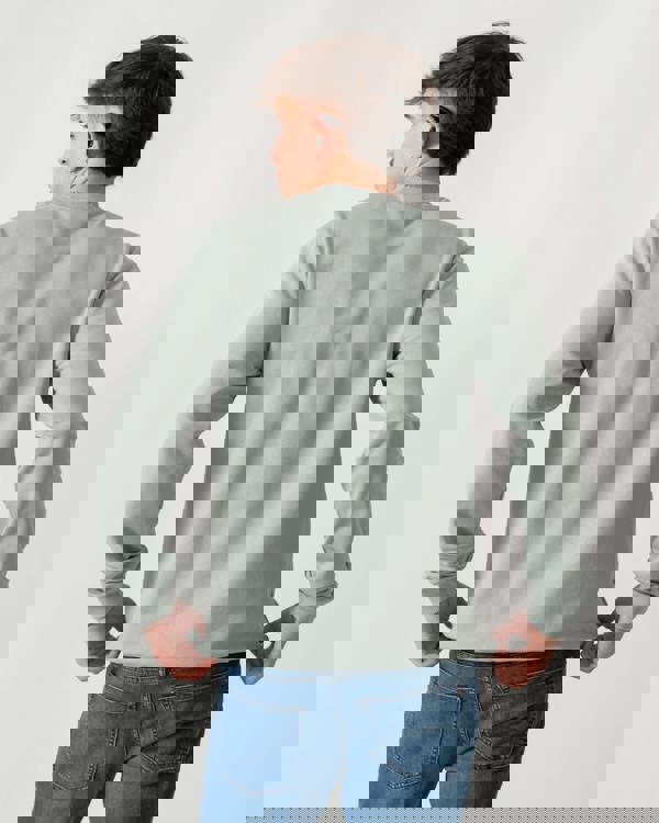 back shot of a model wearing a Fjallraven 1960 Logo Badge Mens Sweatshirt in Misty Green 674