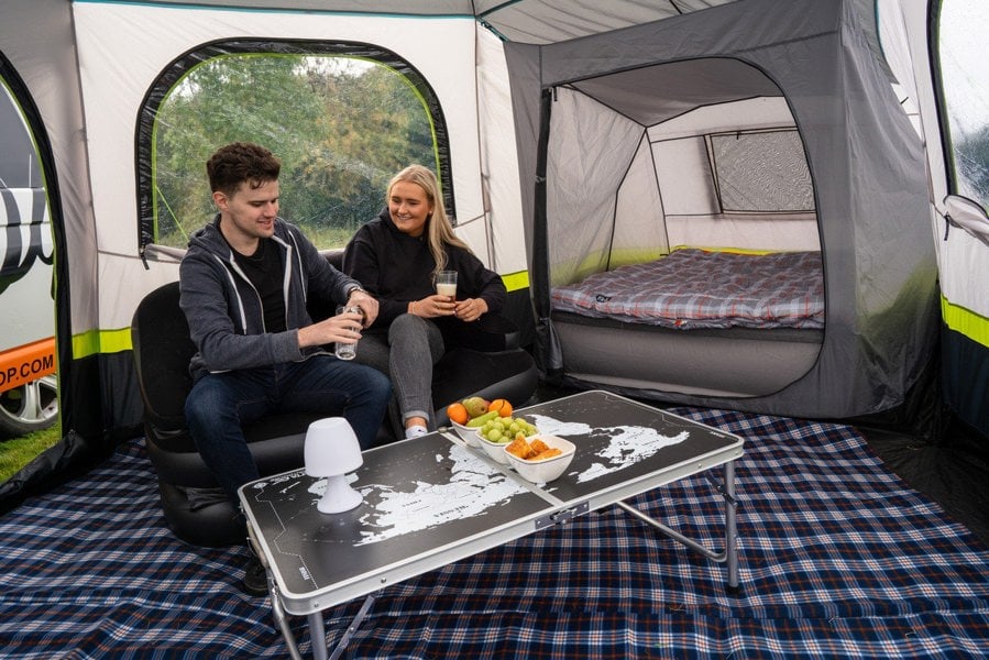 An adult couple inside of the Hive Campervan Awning Fibreglass Poles - with Sleeping Pod from OLPRO.