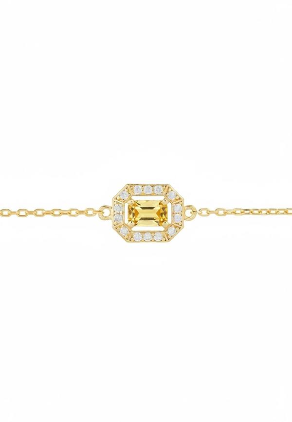 Gold bracelet with a green gemstone in the centre surrounded by diamonds