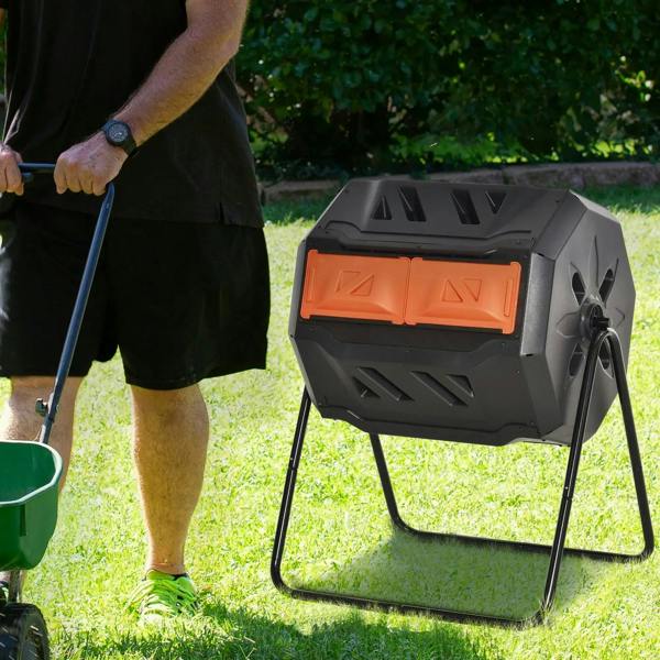 Orange and black rotating composter on metal legs with front sliding doors