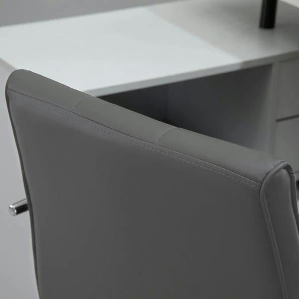Close-up of grey desk chair armrest and side panel with faux leather finish and stitching