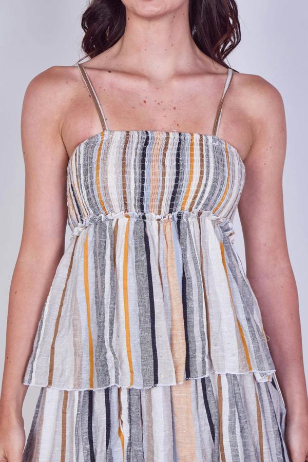 Striped dress worn by a person on a plain background