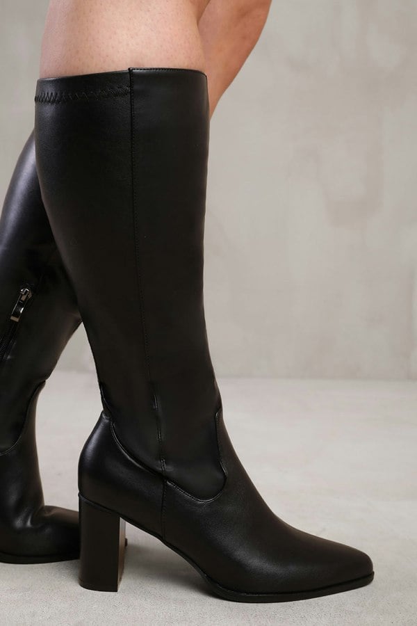 Where's That From Hawthorn Stretch Wide Calf Block Heel Knee High Boots With Stitch Detail in Wide E Fit in Black Faux Leather