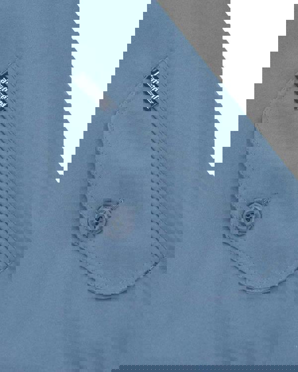 Lambretta Mens ShowerProof Classic Harrington MOD Scooter Jacket Coat, close-up of a light blue jacket pocket with a button and Lambretta brand label.