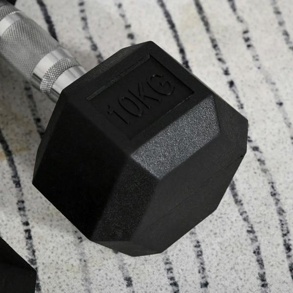 Black hex rubber dumbbell head with embossed 10kg weight mark and rubber texture