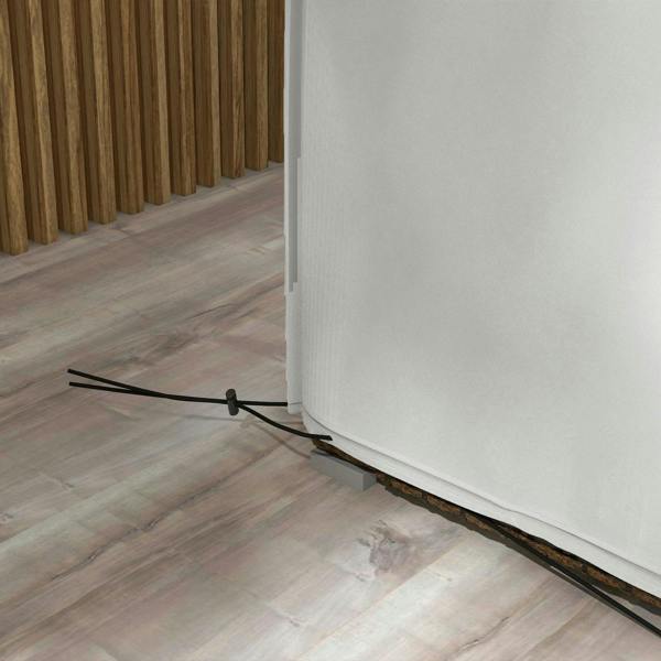 Grey patio furniture cover corner with black securing strap at the hem