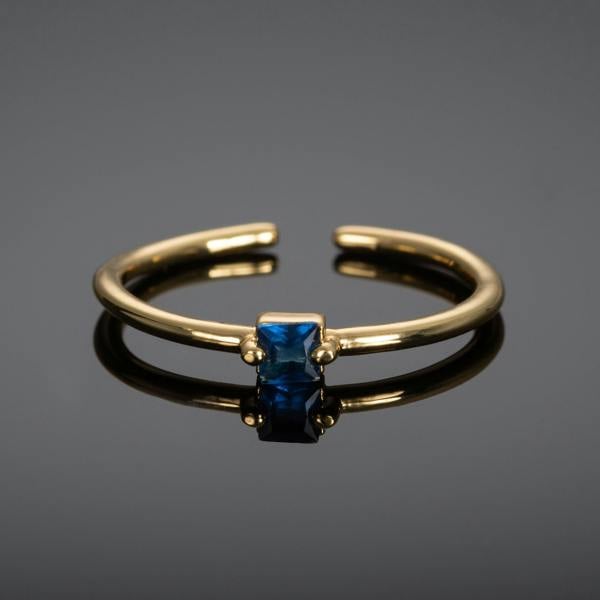 Adjustable Gold Plated Ring for Women with a Blue Cubic Zirconia Stone - namana.london