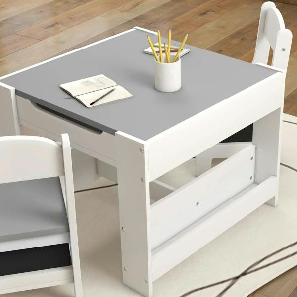 White kids table with grey tabletop and open side cubby storage beside chair