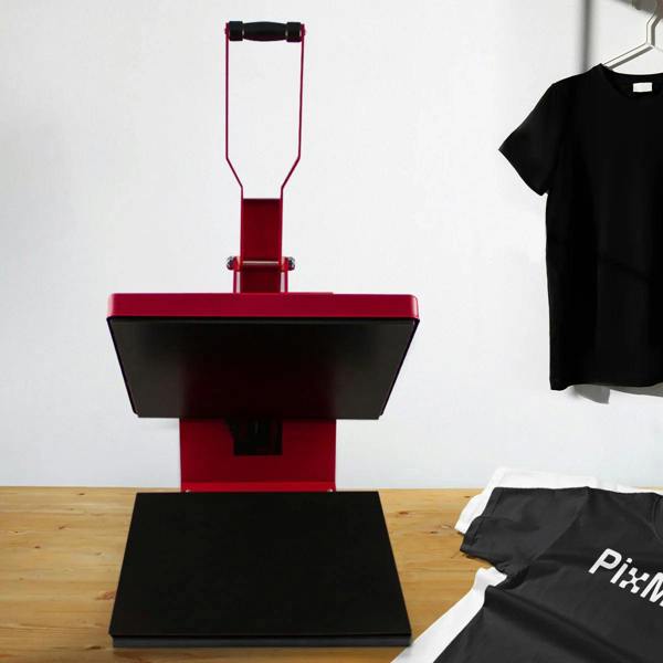 PixMax T-Shirt Sublimation Heat Press Machine in red, 38cm x 38cm clam design, with a sleek black pressing surface and nearby shirts