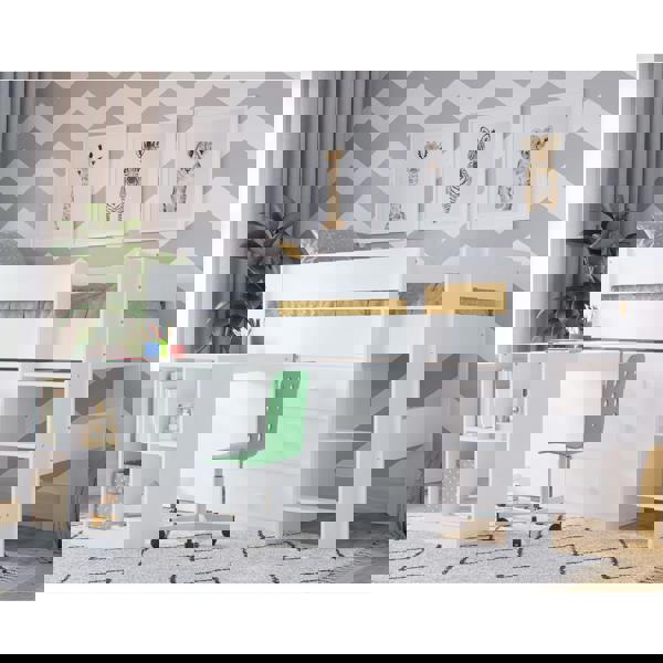 Chest of drawers in a modernly decorated bed room. Tucked underneath a mid sleeper, out of the way.