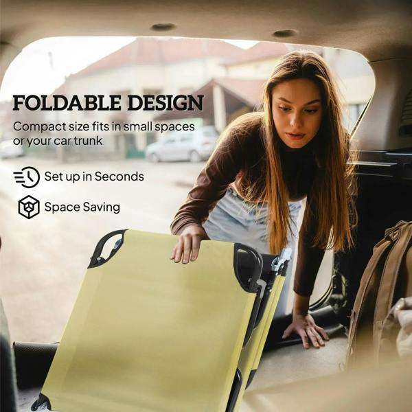 Beige foldable sun lounger with black frame, set up in a vehicle space