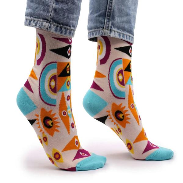 Crew socks with colorful geometric evil-eye motifs and teal heel and toe panels.